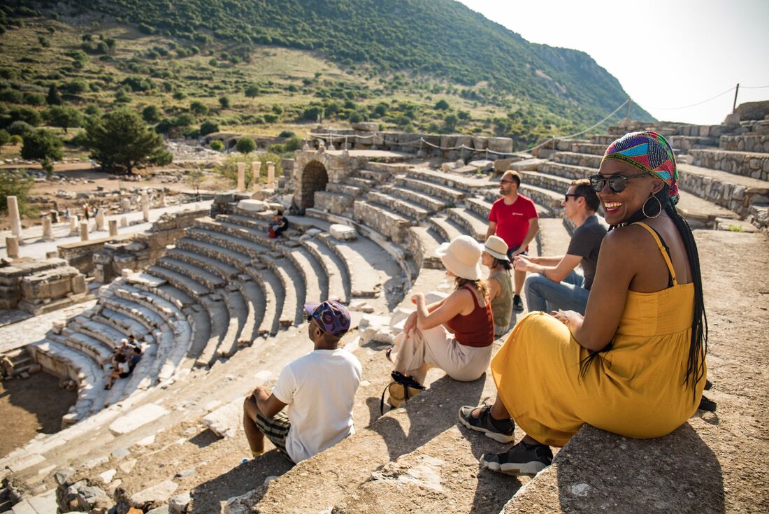 Intrepid group seated in the ancient Greek theatre of Ephesus in Turkey