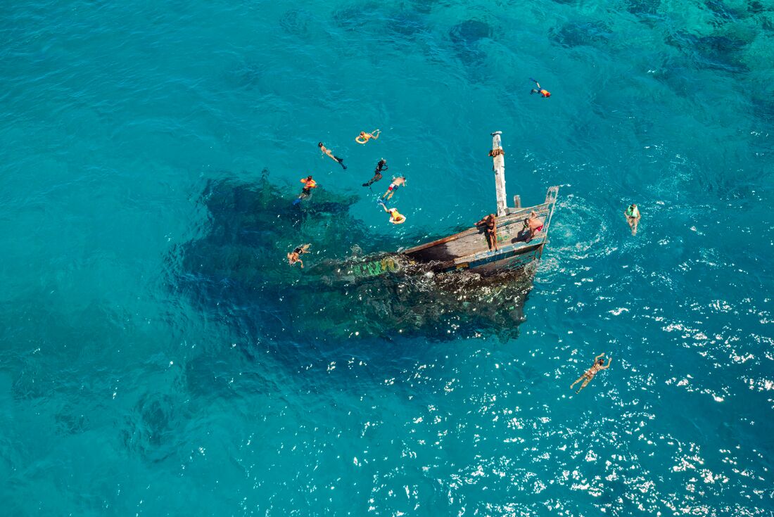 Drone view of travellers swimming at Keyodhoo shipwreck
