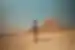 Traveller walking by the Great Pyramids of Giza