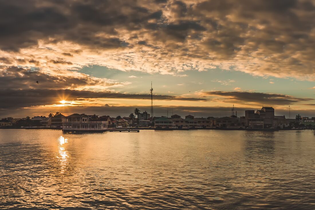 Sunset over Belize city seen from a catamaran in the evening