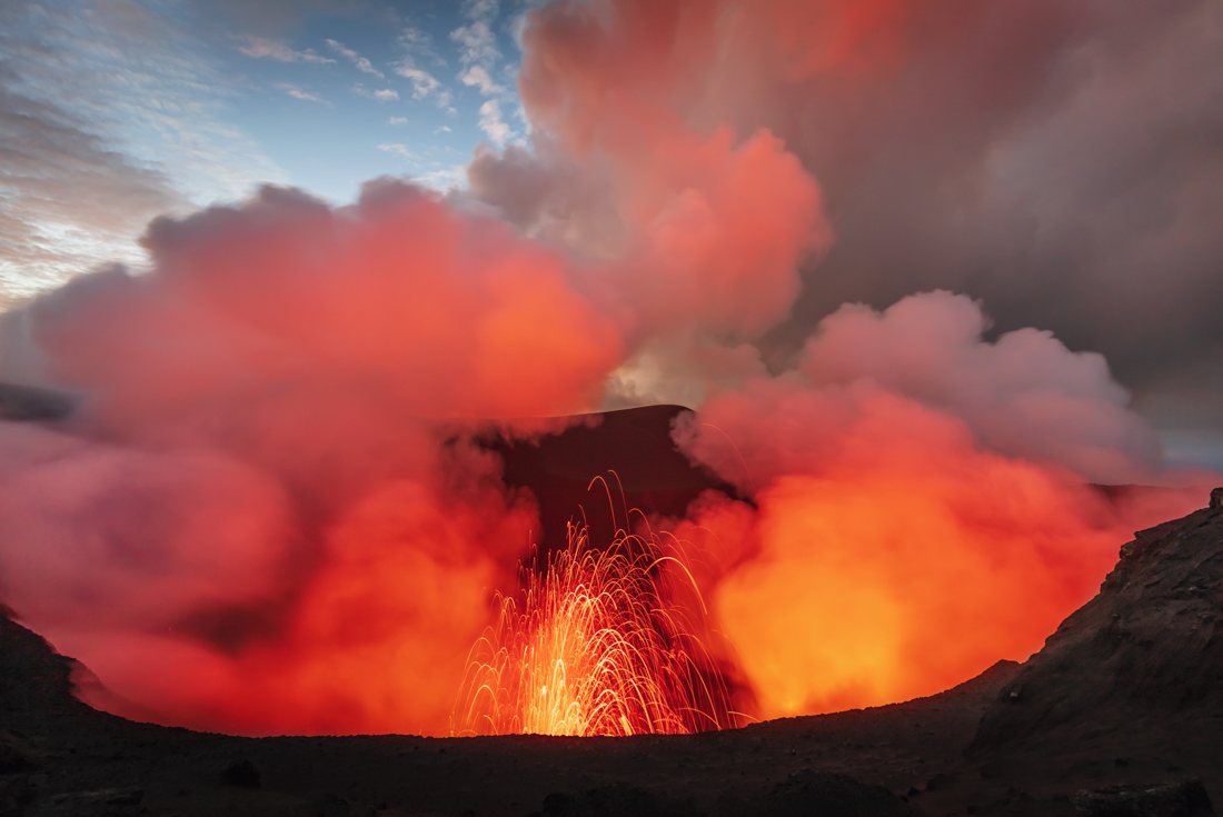 Lava fires out of the crater aat the top of Mount Yasur, Tanna island, Vanuatu