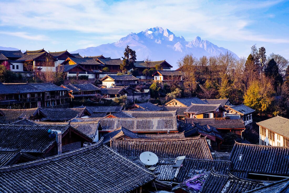 Lijiang Oldtown with Jade Dragon Snow Mountain peaking up from behind in China
