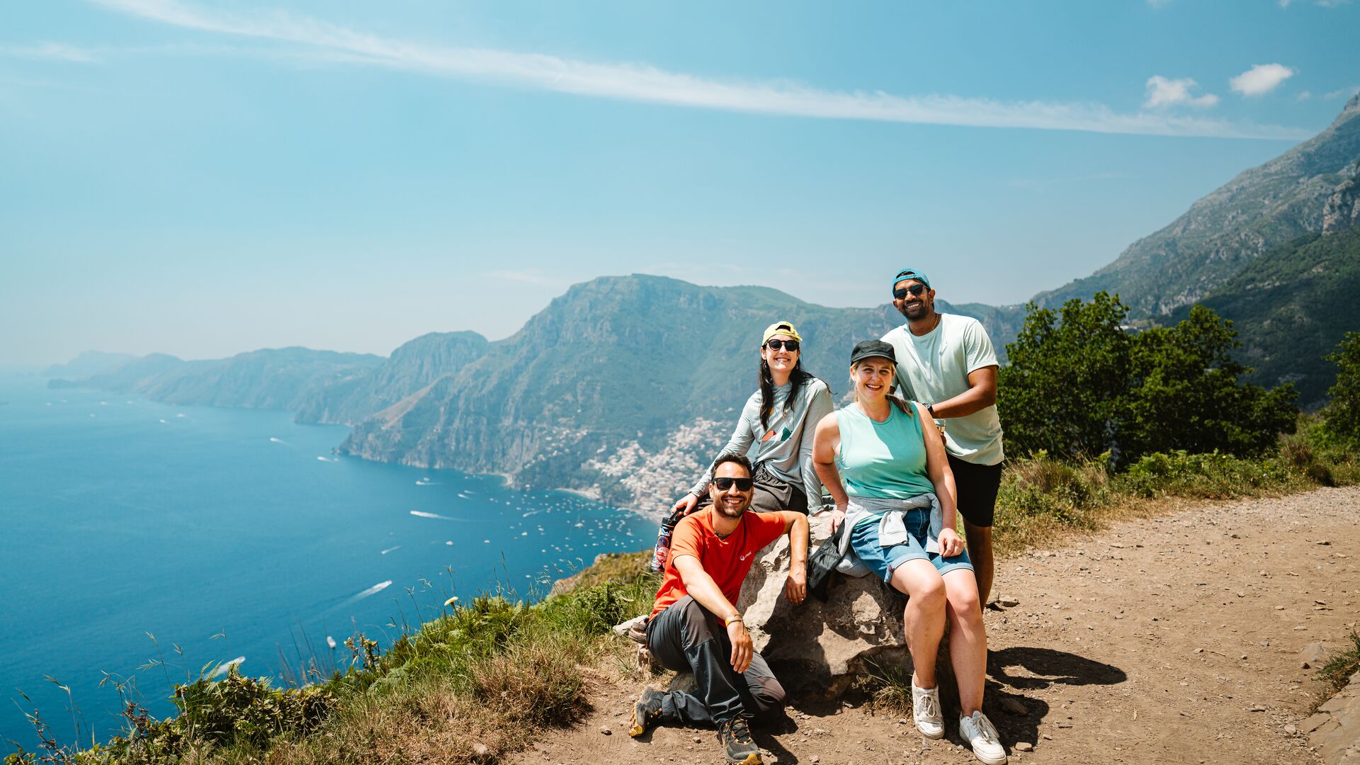 Intrepid group smiles as they pose along the Path of the Gods on the Amalfi Coast.