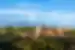 The epic exterior of the Alhambra Palace in the green hills of Granada, Spain