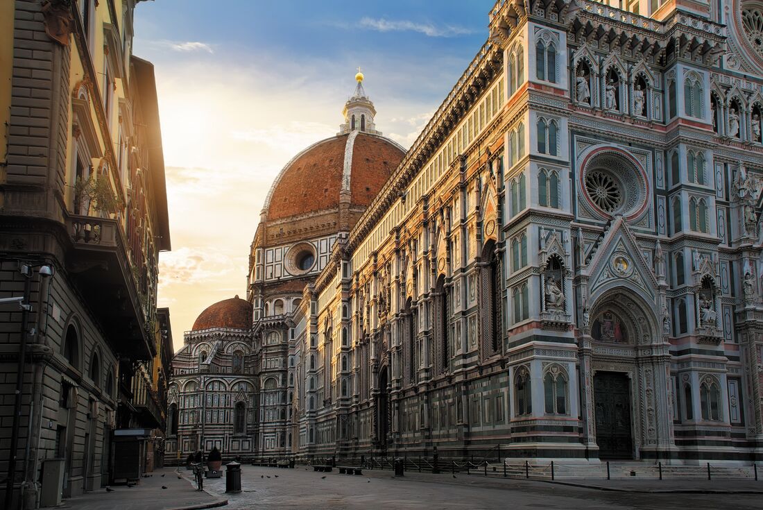 Piazza del Duomo in Florence hit by the sunrise in Italy