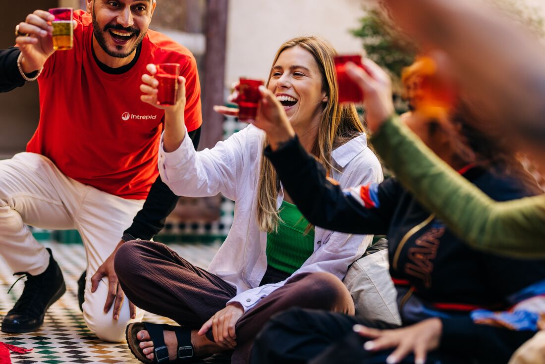 Intrepid travellers and leader cheers tea in Marrakech, Morocco