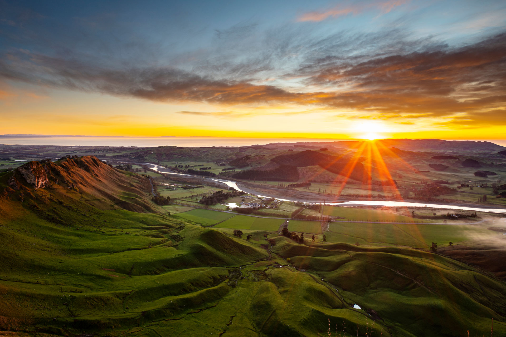 Looking out over Hawke's Bay and the Craggy Range Winery from Te Mata Peak at sunrise