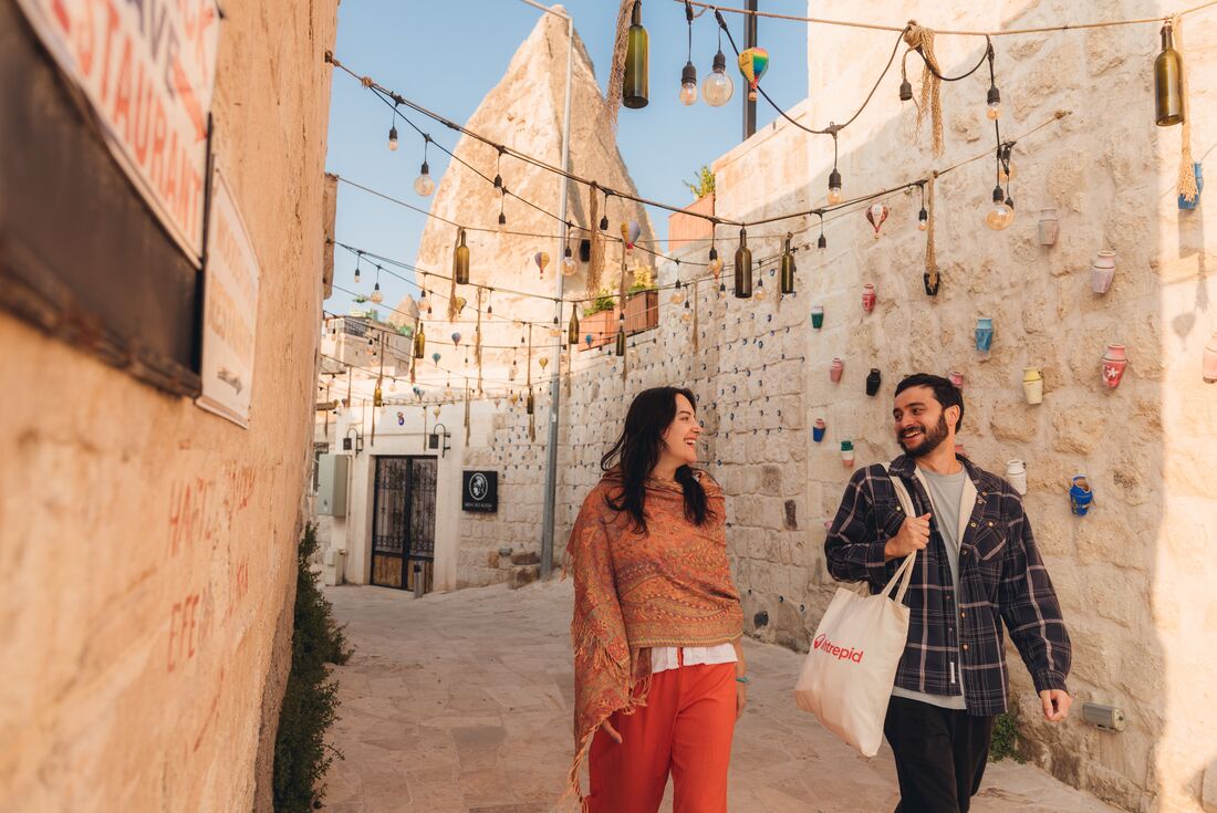 Two smiling travellers taking a walk in Cappadocia, Turkey