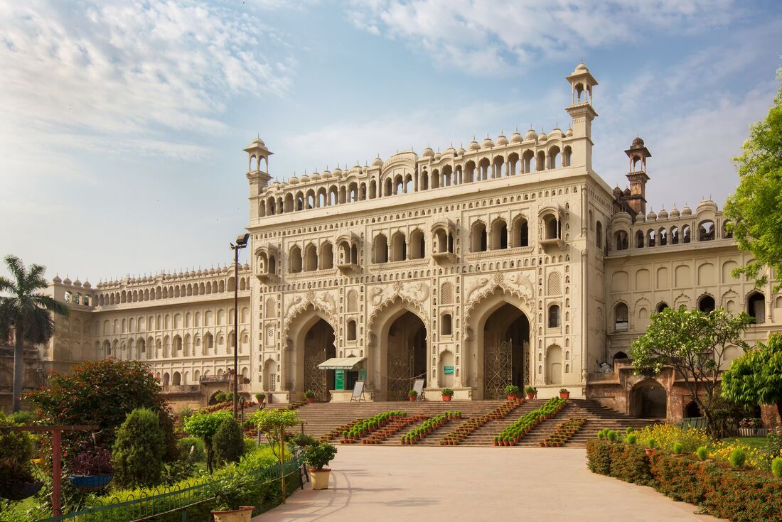 Ornate facade of Bara Imambara mosque surrounded by gardens in Lucknow India