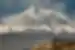 Wide view with Khor Virap Monastery buildings in foreground with Mount Ararat looming beyond