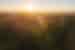 Sunrise over the Transilvanica Trail forest in Romania