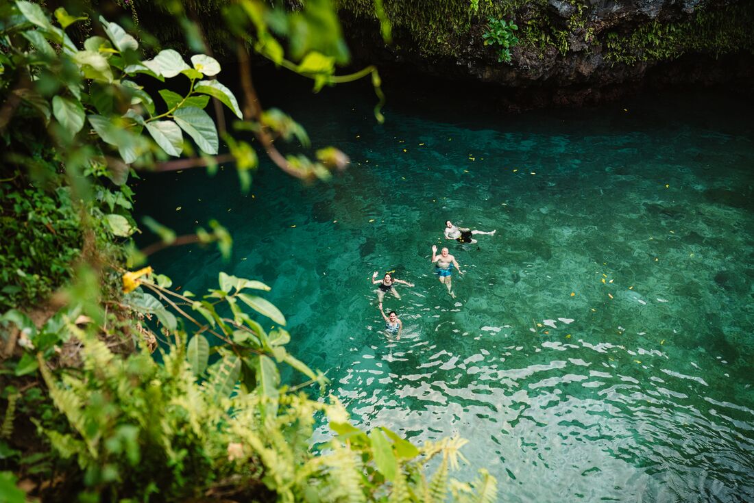 Looking down at To Sea Trench where travellers are swimming, Samoa