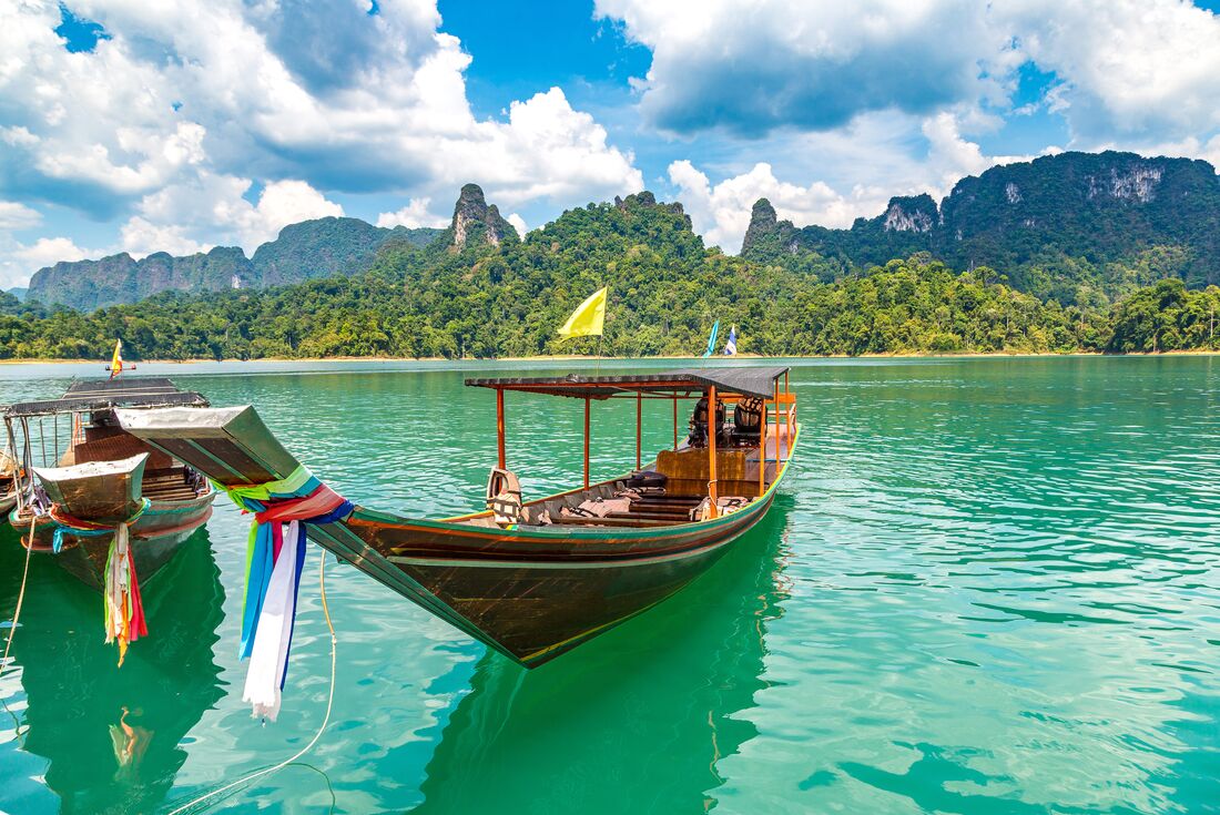 Long tail boat on Cheow Lan Lake in Kao Sok National Park, Thailand