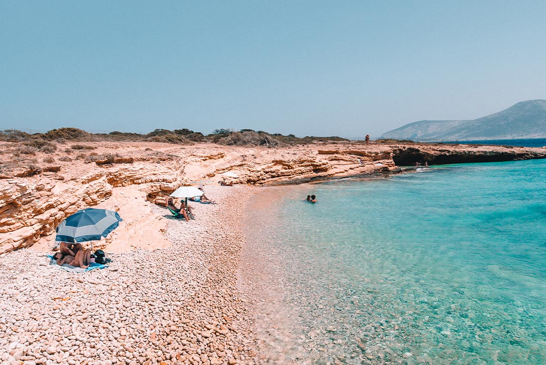 Pebbled beach on the coast of the Cycladic islands, Greece