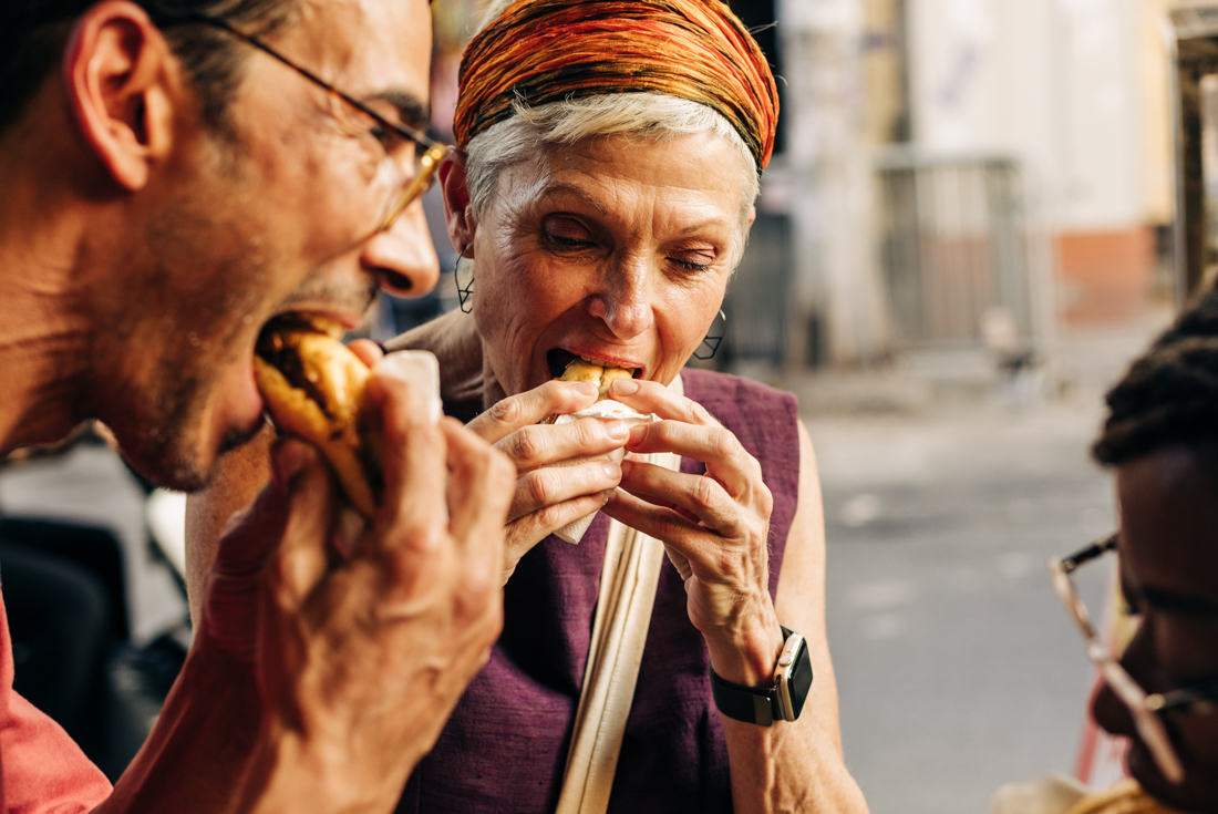 Intrepid travellers enjoy fresh food in the streets of Hanoi