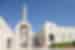 Exterior of the Grand Mosque in Muscat with travellers carrying through to the interior in Oman