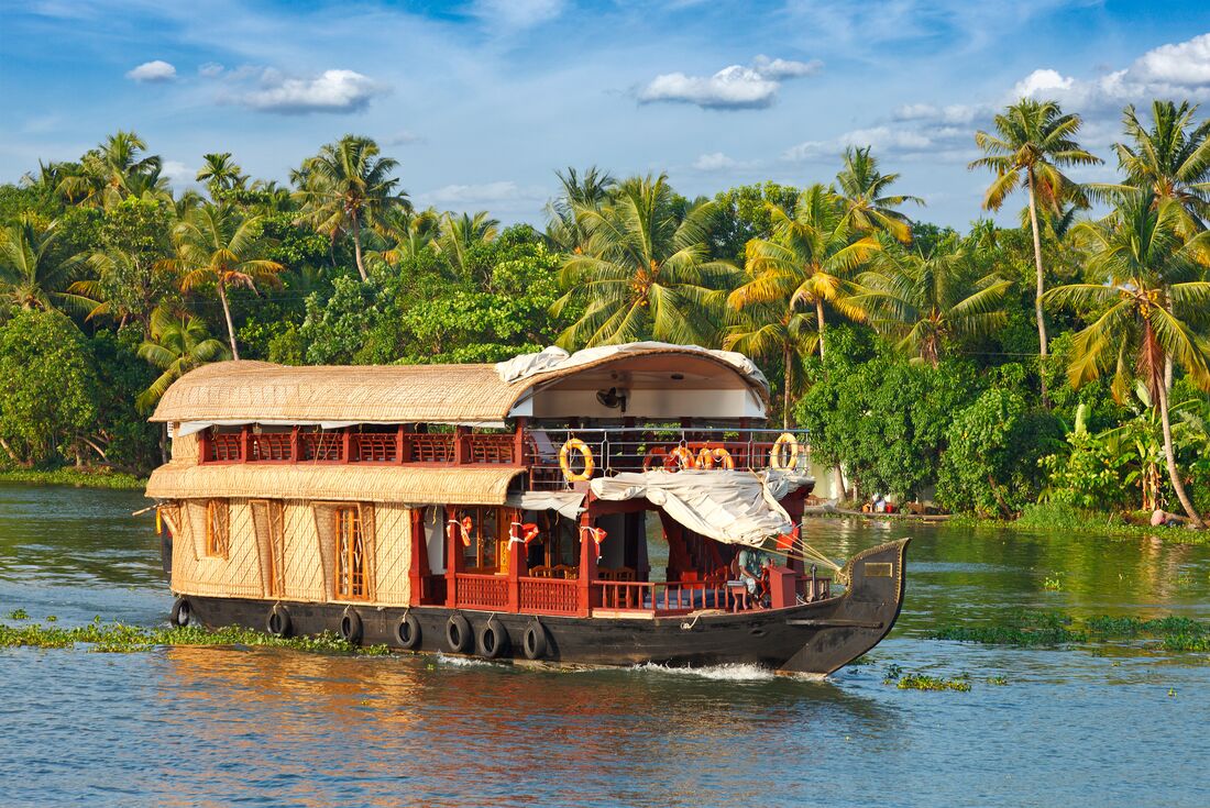 Cruising Nileshwar backwaters on an iconic houseboat in southern India