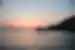 Intrepid travellers swimming and splashing in Syros at sunset