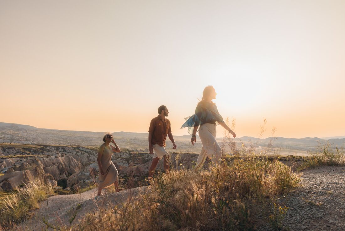 Travellers on a sunset hike in Cappadocia, Turkey