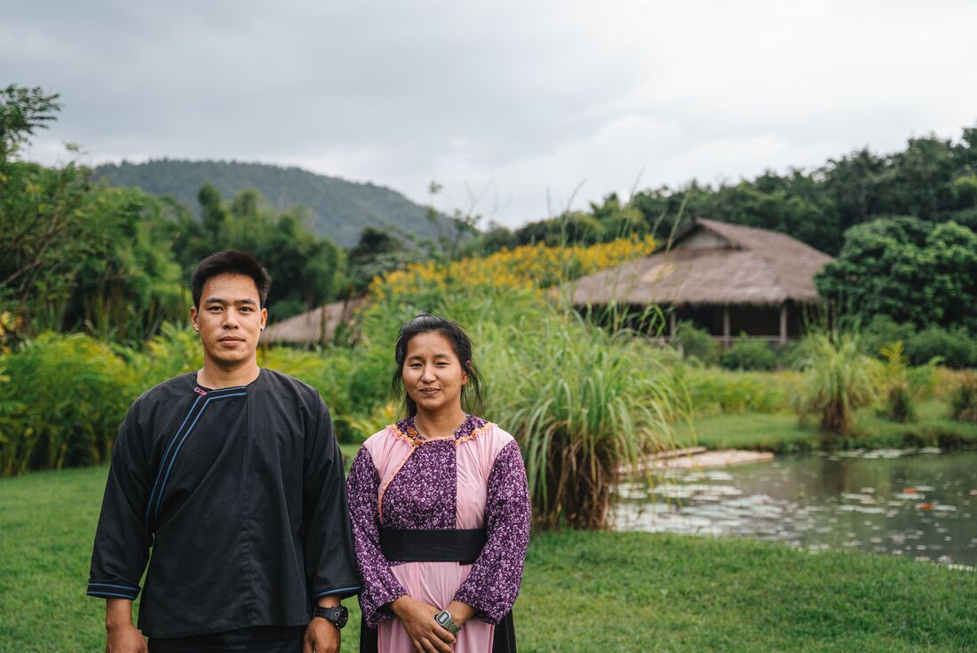 Local staff on the grounds of Lisu Lodge feature stay in Thailand