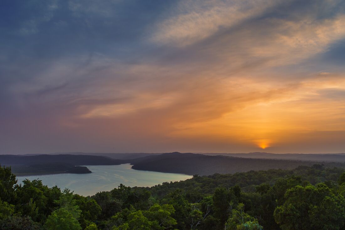 Sunset over Yaxha-Nakum-Naranjo National Park seen from the pyramids