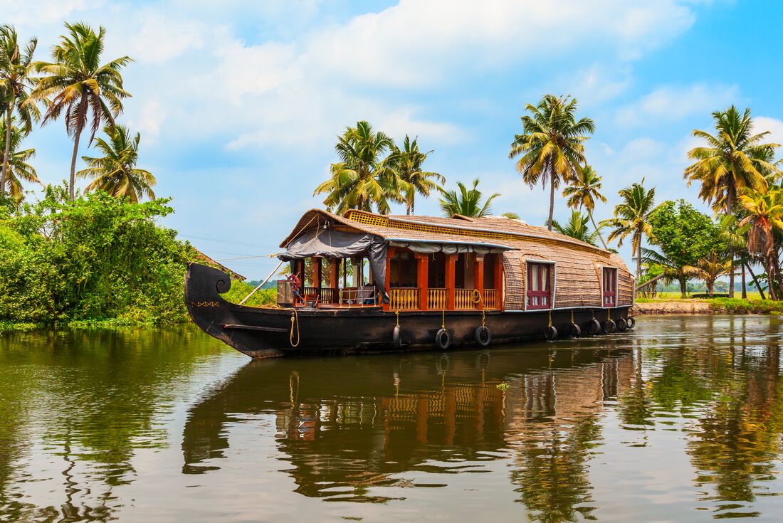 The iconic houseboats of Nileshwar backwaters off the Indian coast