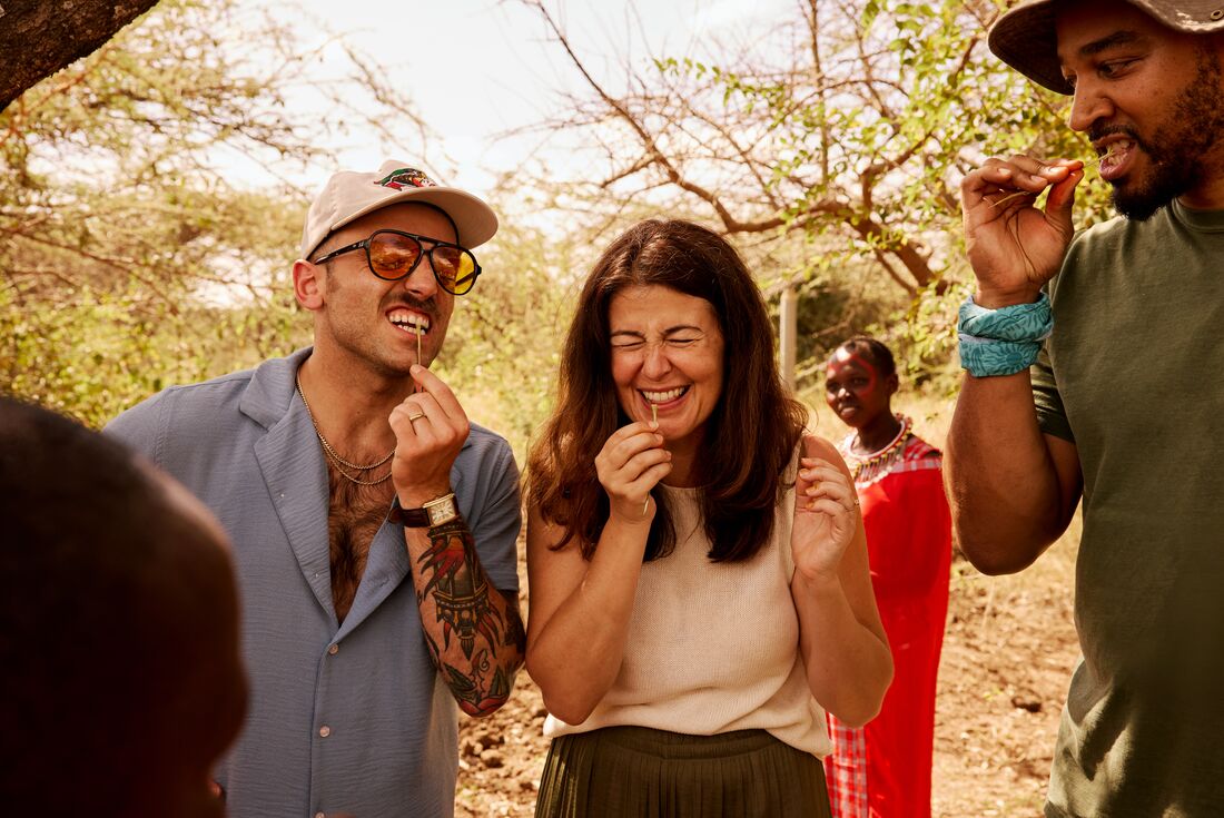Trying traditional toothbrushes in Tepesua village with the Maasai