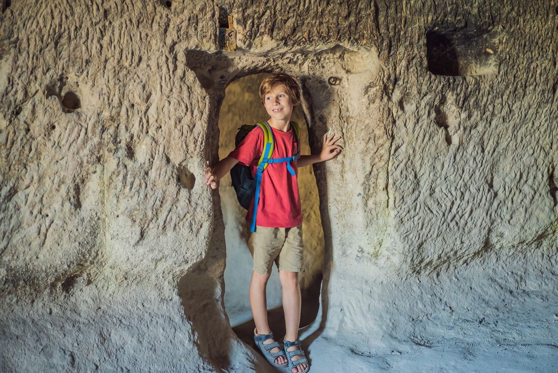 Young Intrepid traveller exploring the caves of Cappadocia 