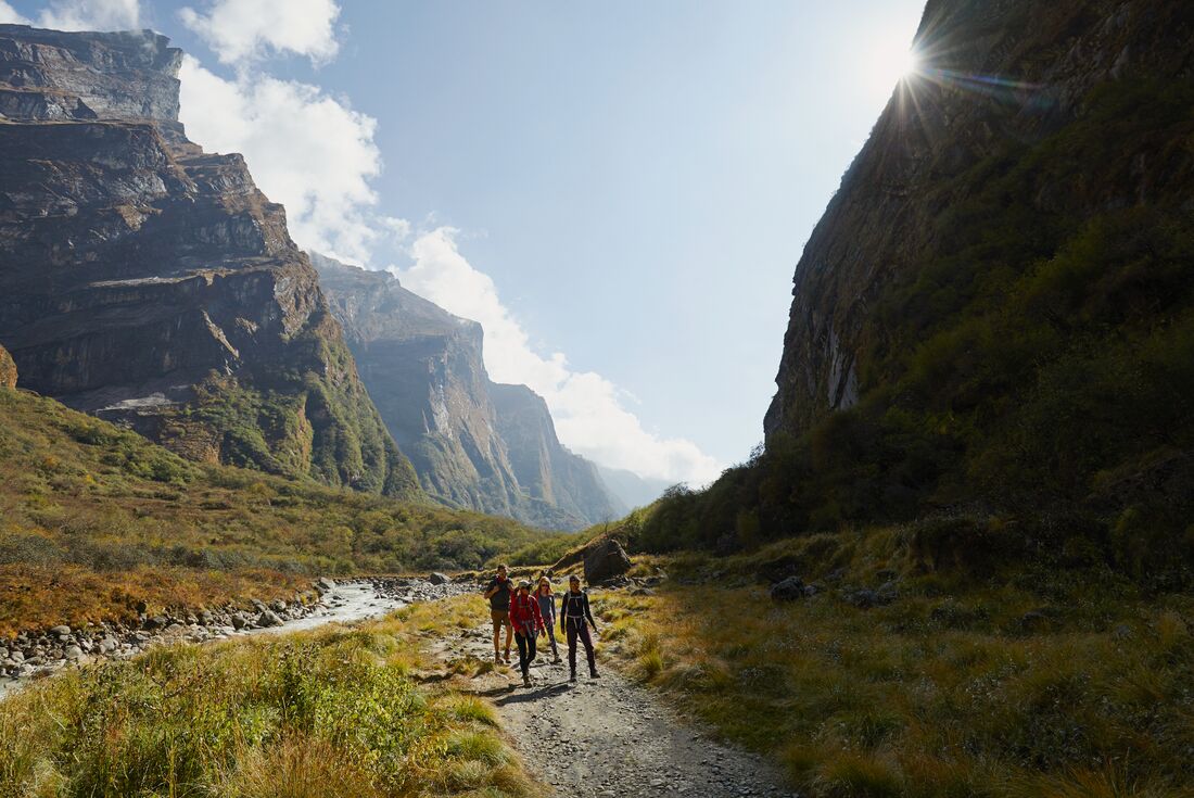 Intrepid traveller group with leader trek among giants in Annapurna region of Nepal