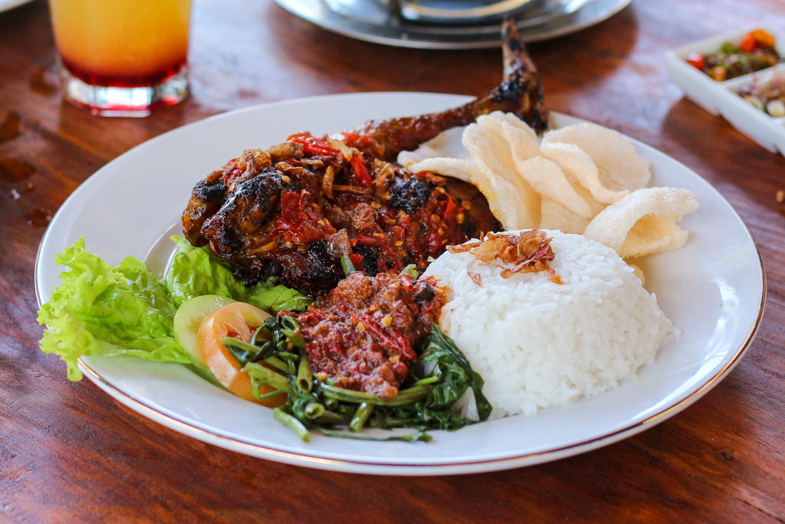 Ayam Taliwang, a Lombok specialty of chicken covered in sambal with rice and greens