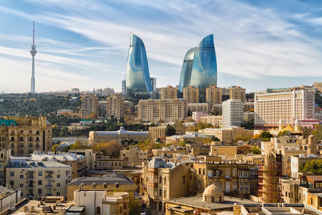 Old town Baku viewed from height, with the Flame Towers visible in distance