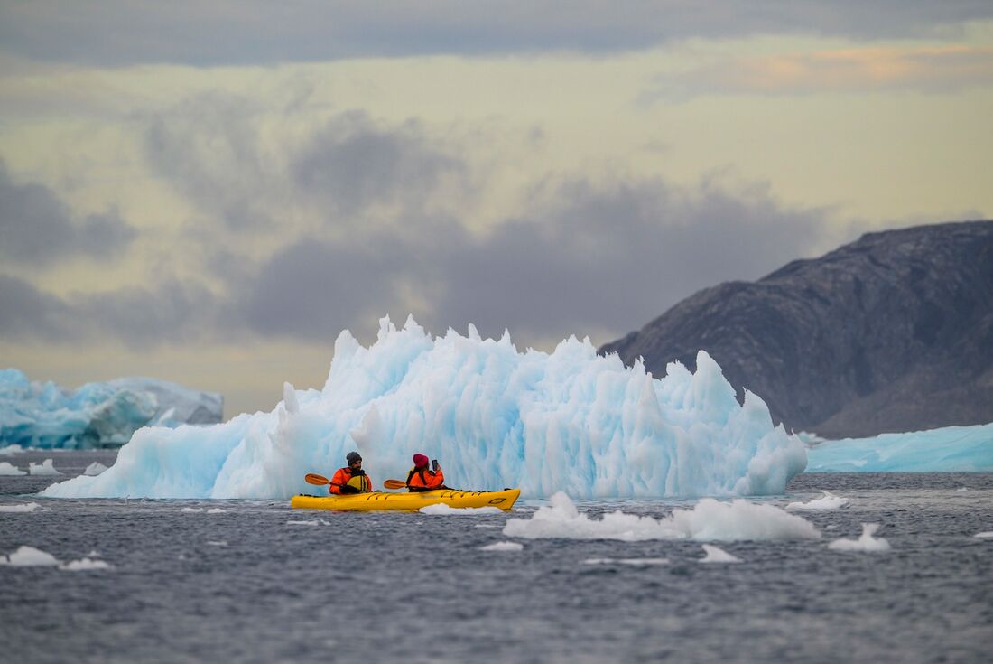 Kayaking among the ice and mountains of Sermilik fjord
