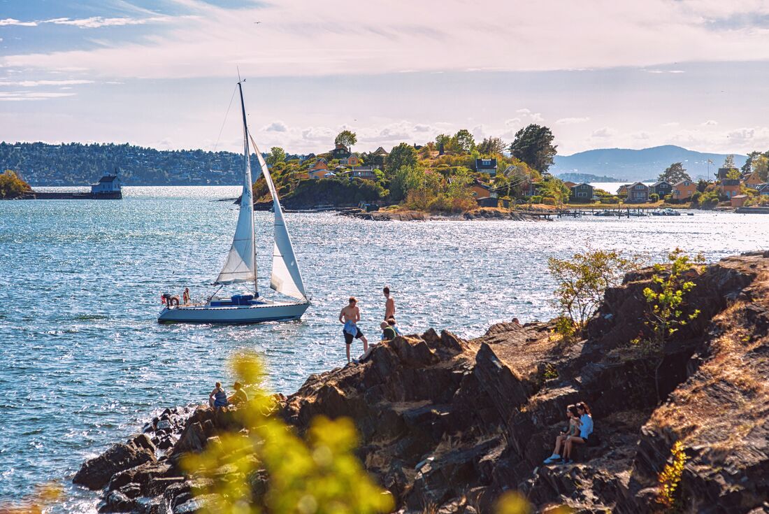 Oslo harbour with travellers relaxing after a swim