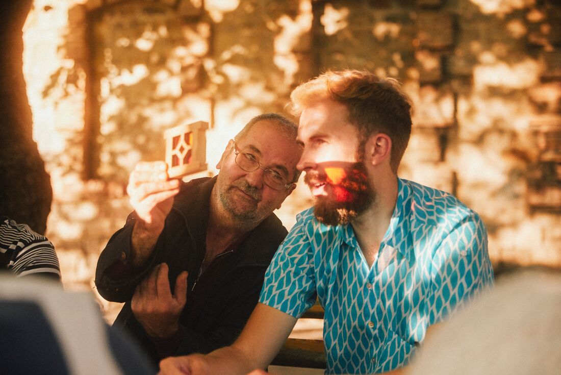 Intrepid traveller is shown a piece of Shebeke, Azerbaijan's answer to stained glass, by a master in Sheki