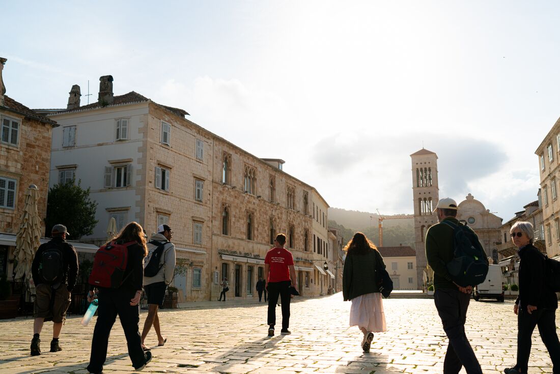 Intrepid leader guides travellers touring the island of Hvar off the Dalmatian Coast in Croatia