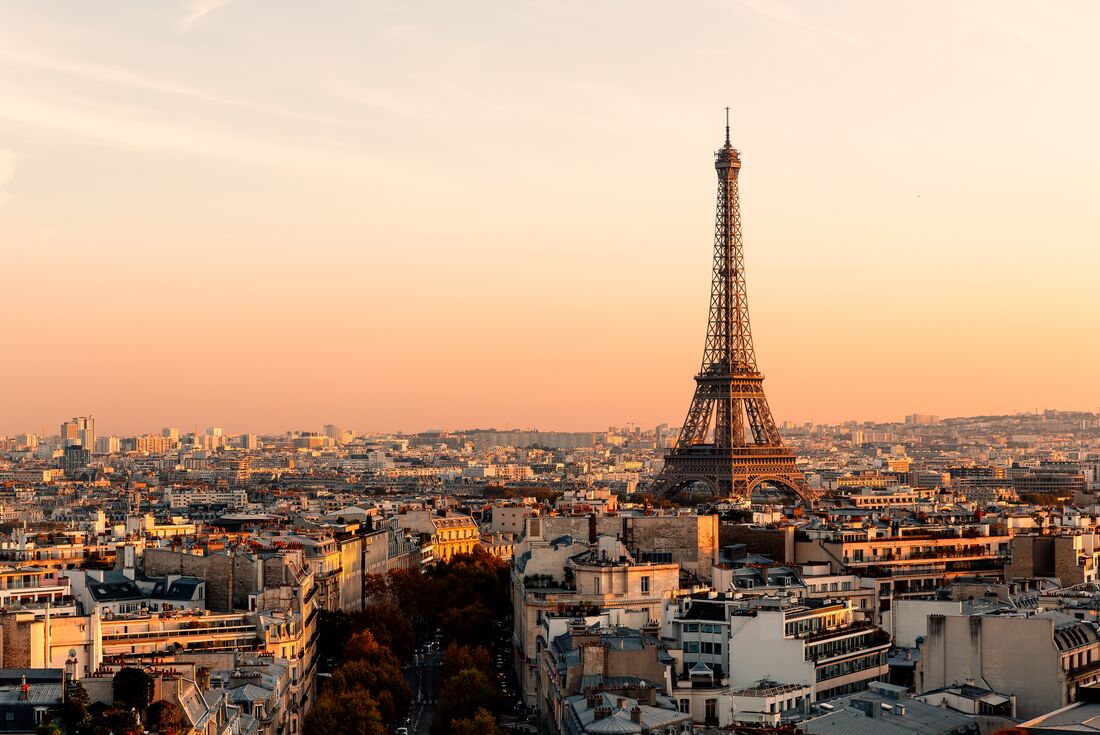 Paris skyline with the Eiffel Tower visible at sunset in central France