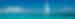 Sailboat on the water in the tropics under bright blue skies