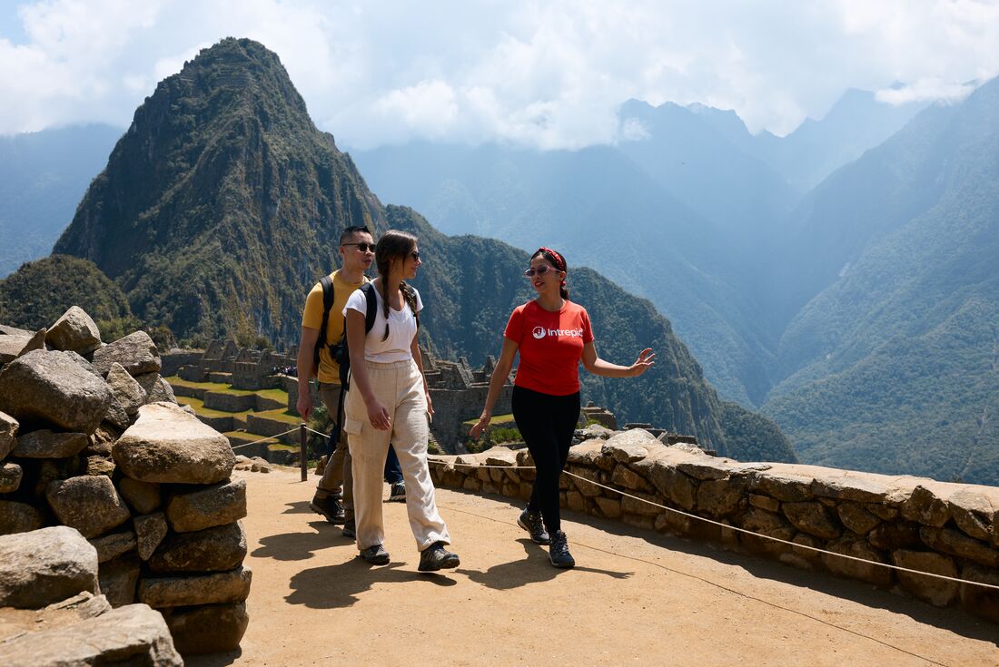 Intrepid leader gives a talk while touring Machu Picchu in Peru