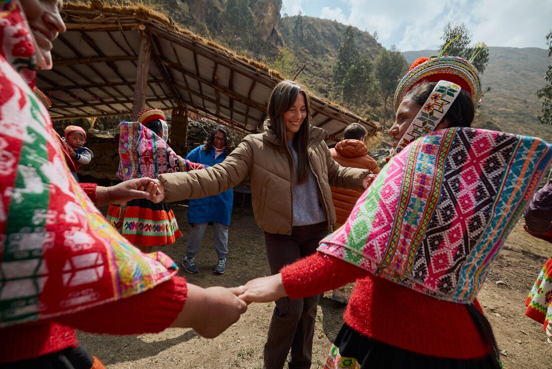 Huilloc community dances with Intrepid travellers in Sacred Valley Peru