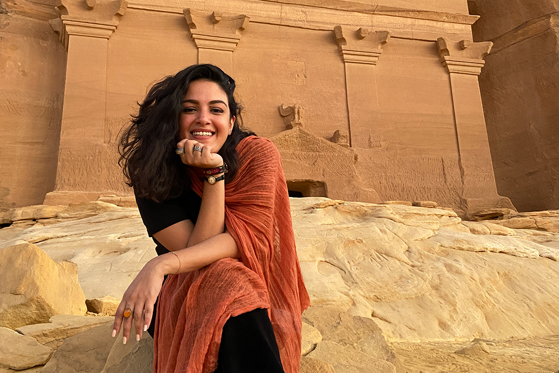 Smiling local leader seated near the Nabatean tombs, Hegra, Al Ula, Saudi Arabia