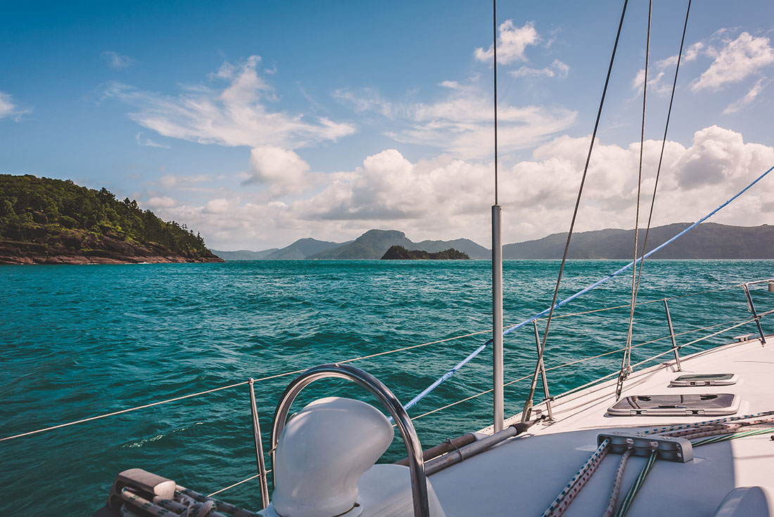 View of Whitsunday Islands from boat while sailing
