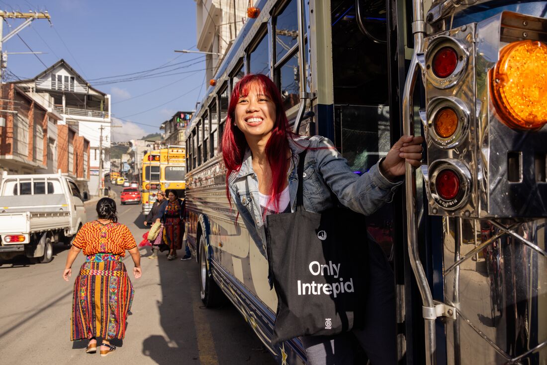 Intrepid traveller looks out as they board a chicken bus in Quetzaltenango in Guatemala