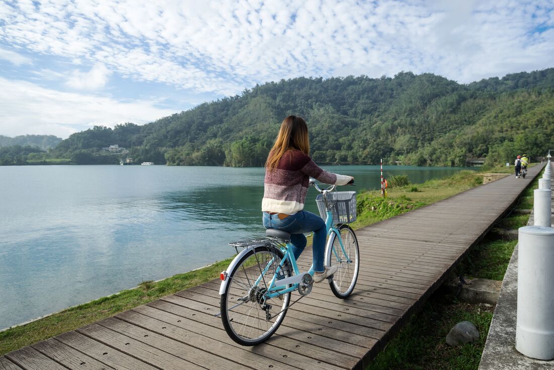 Traveller on classic style bicycle cycling 